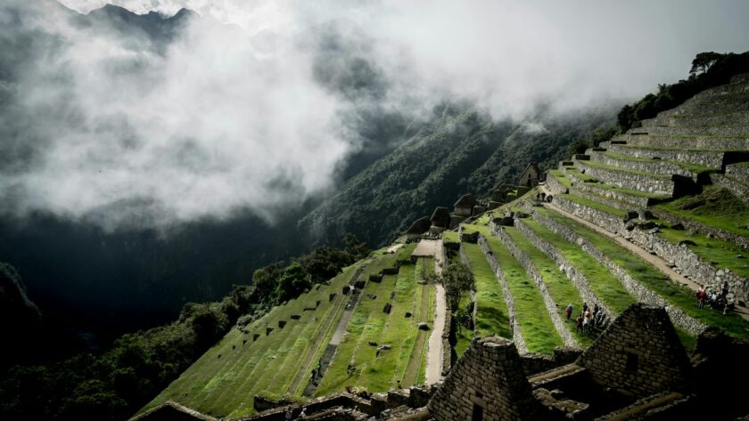 tourists on terraced fields in the lost city of the incas